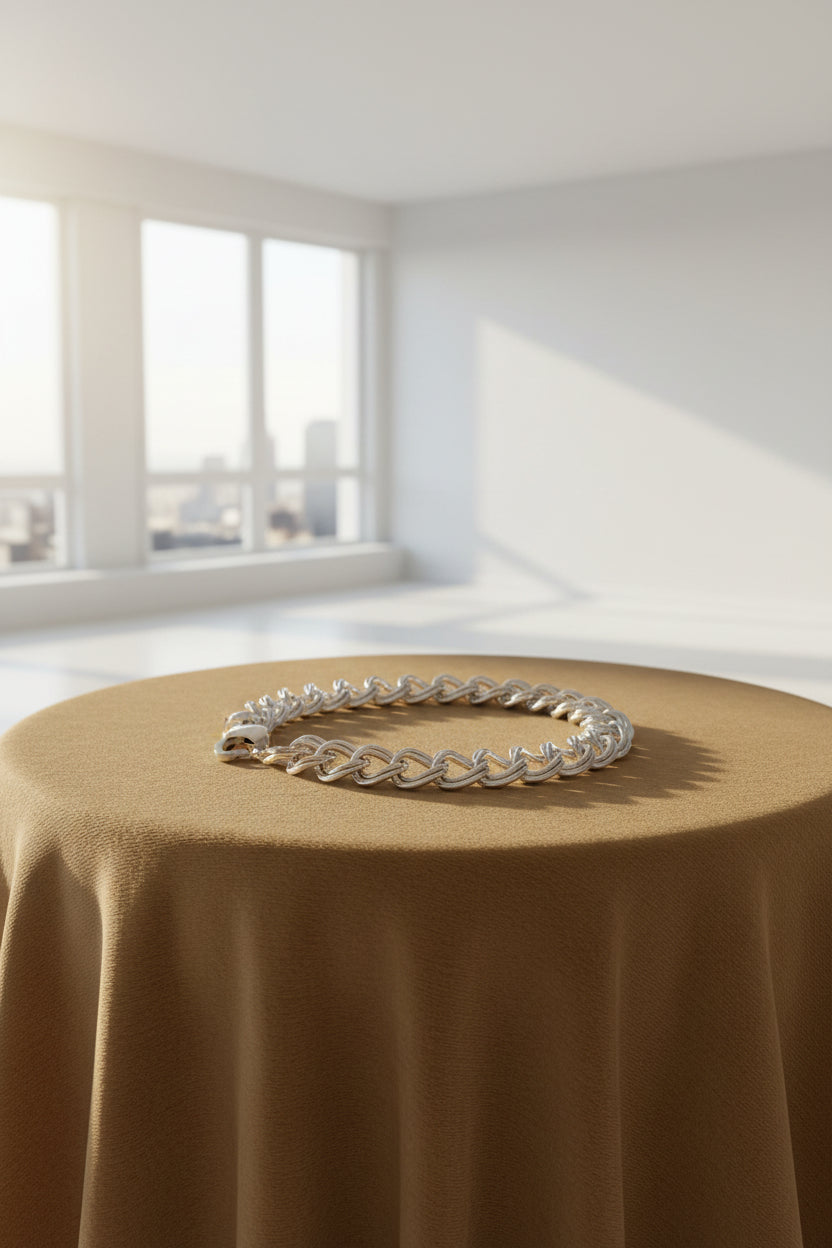 Silver Double link Curb chain bracelet on a Carmel background