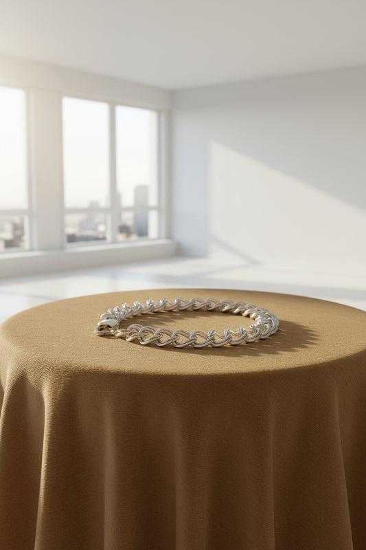 Silver Double link Curb chain bracelet on a Carmel background