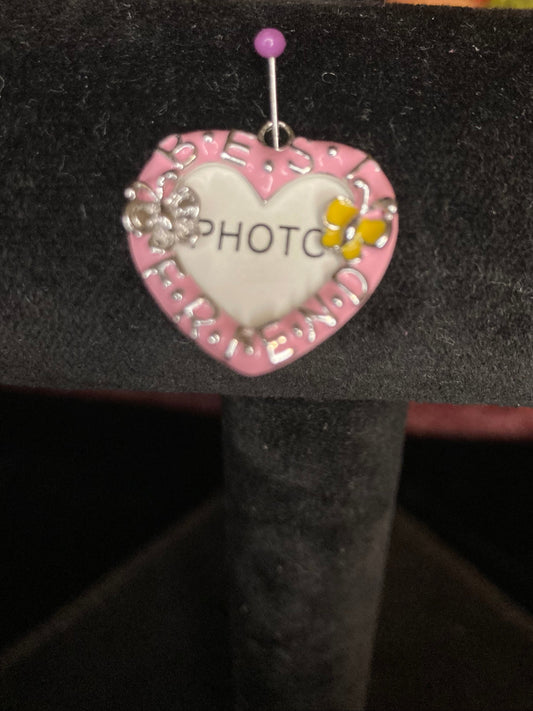 Heart-shaped photo charm with pink border and 'PHOTO' text on a black background