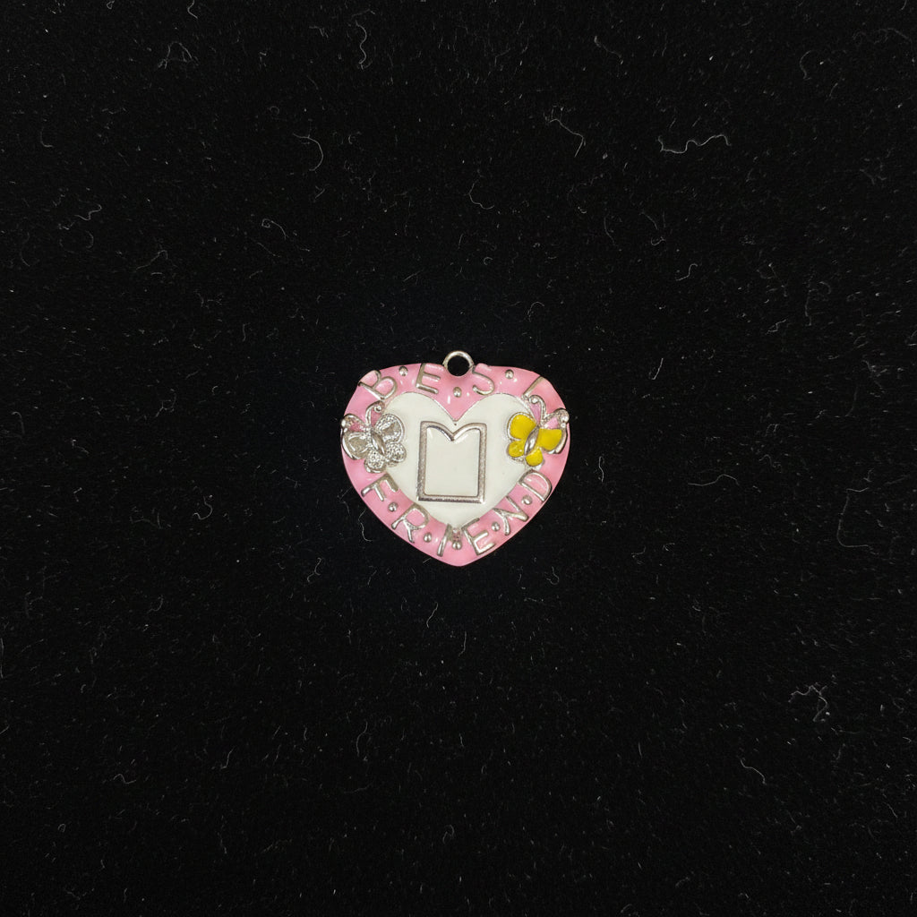 Pink and silver belly button ring on a black stand with floral background