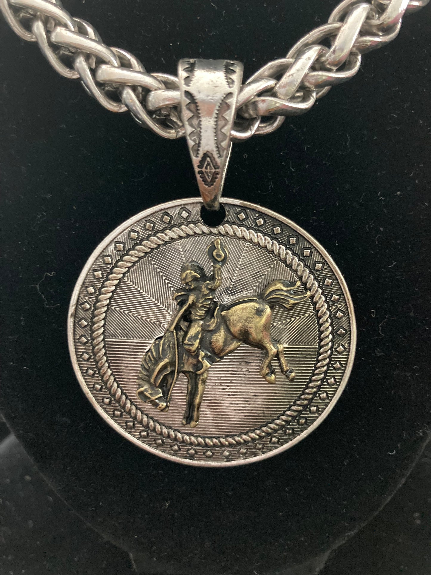 Silver-Plated necklace with a pendant featuring a Cowboy on horseback design.