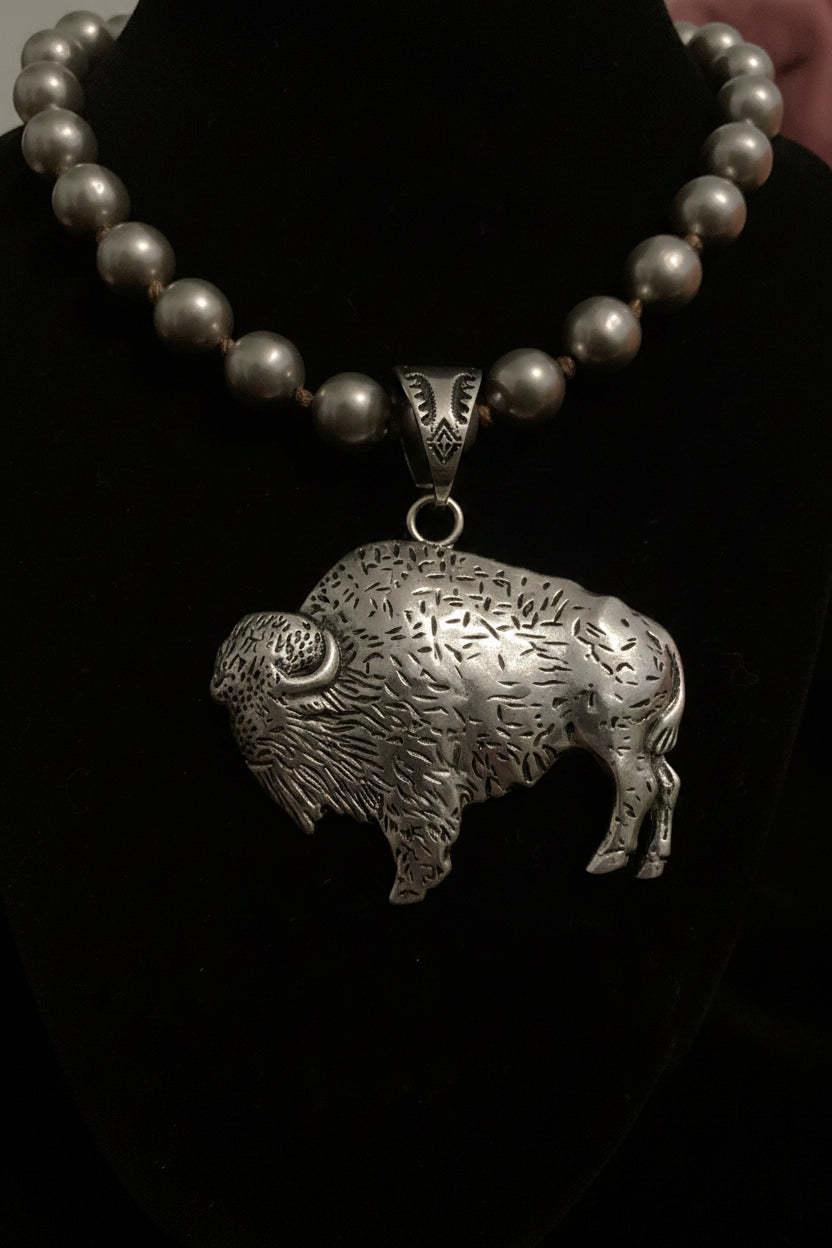 Silver Buffalo bracelet with beads on a dark background