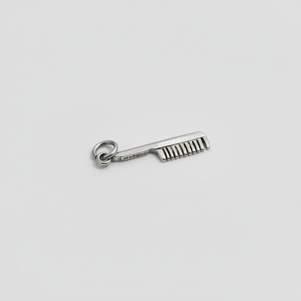 Replica of a comb charm