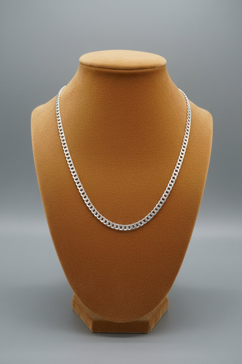 925 Silver chain on a floral-patterned fabric background