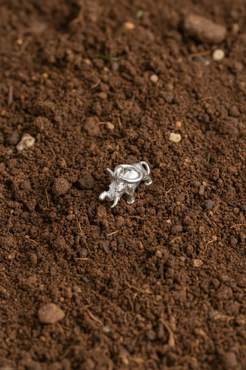 Small Silver elephant charm on a white background