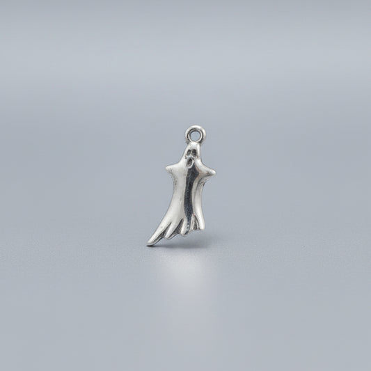 Silver hand-shaped ghost charm on a black background