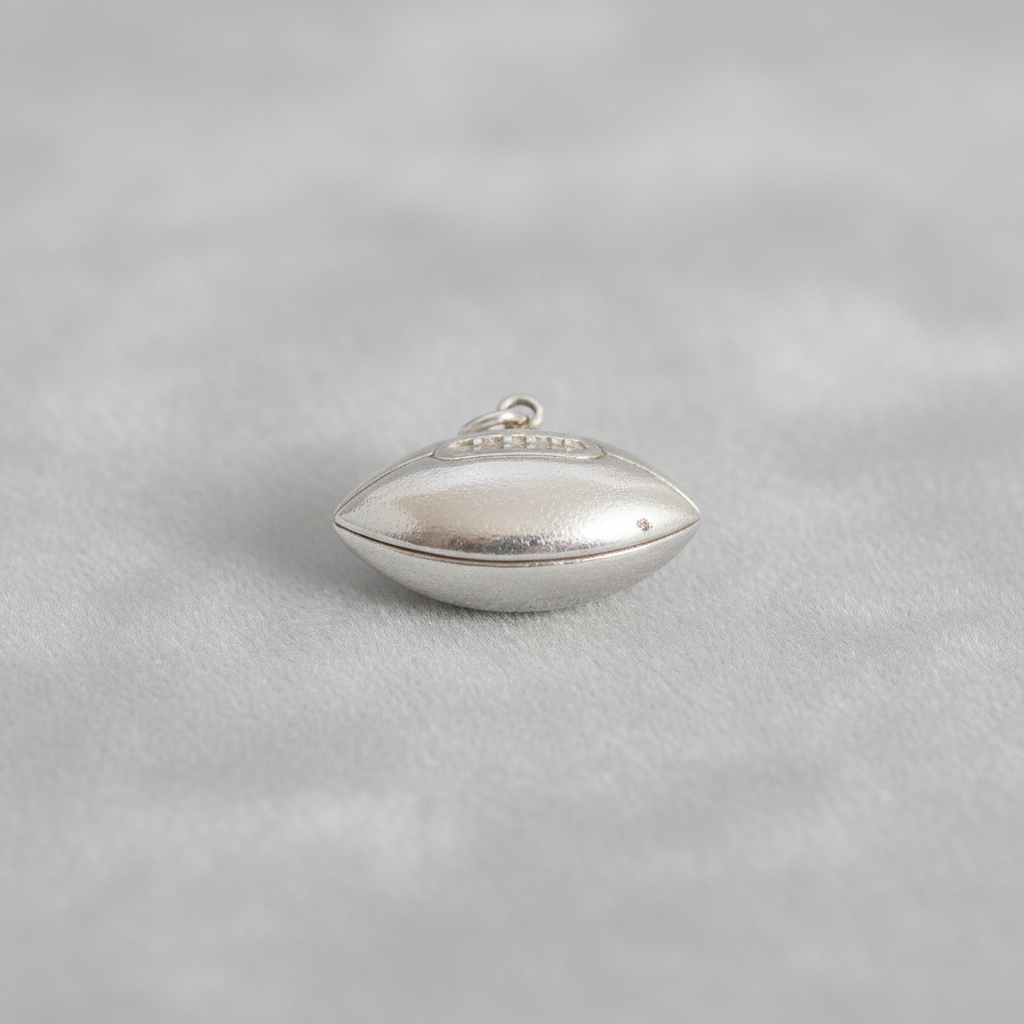 Sterling Silver pendant/charm on a dark background