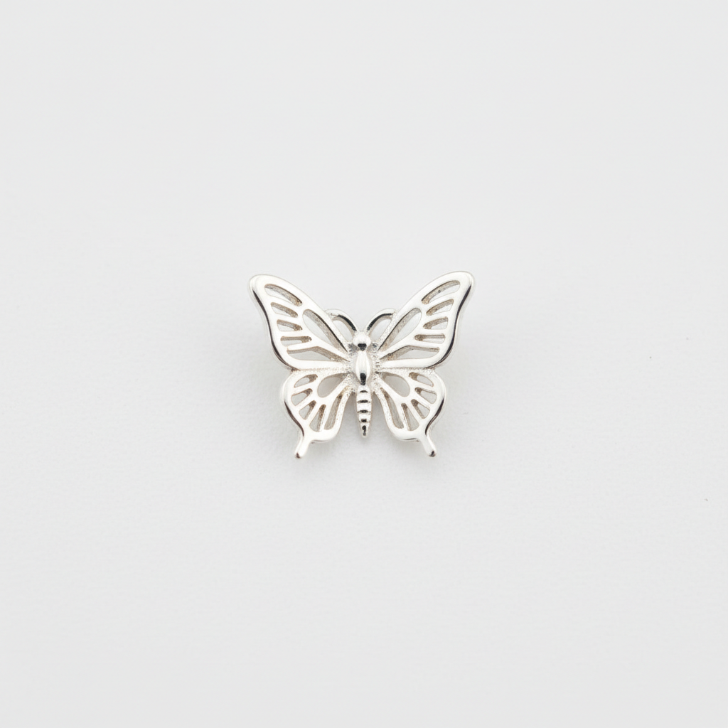 925 sterling silver tiny butterfly charm flat lay on white background