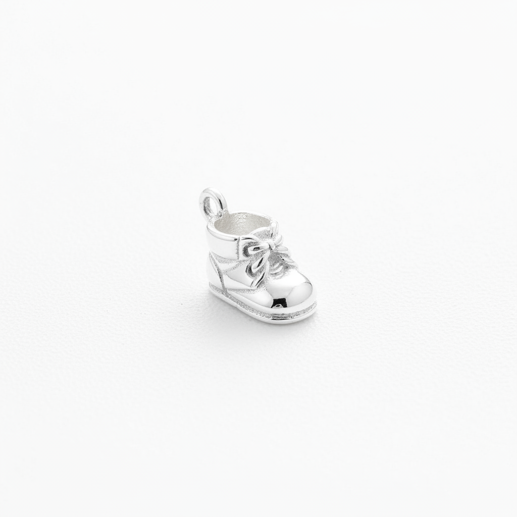 925 sterling silver baby bootie charm flat lay on white background